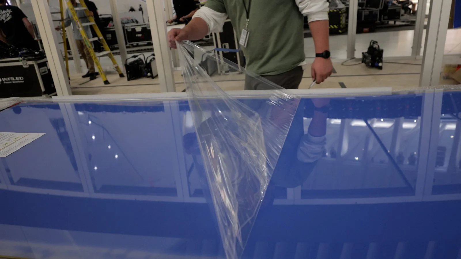 Protective liner peeled back from a pre-wired Smart Plexi® panel