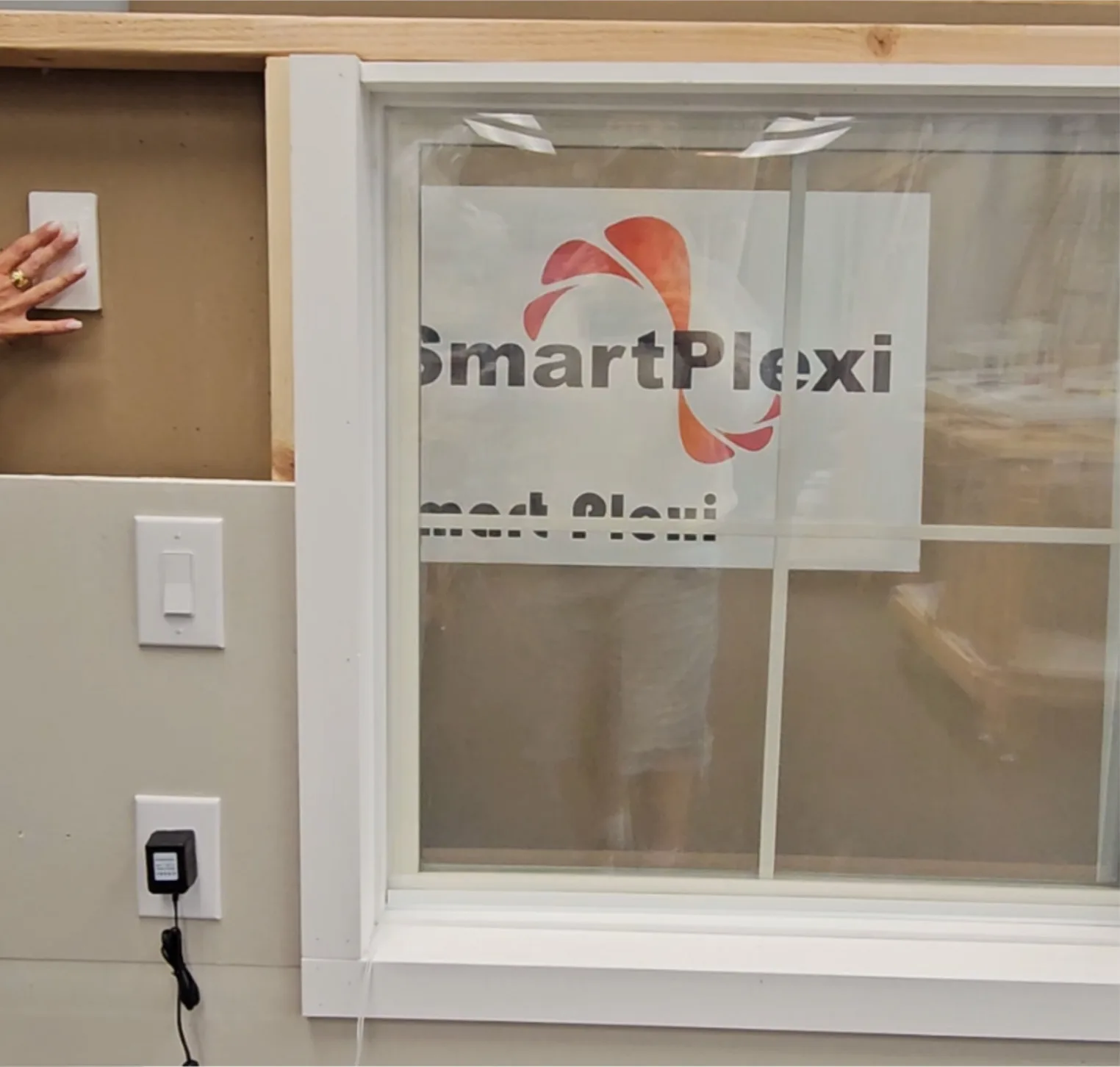 Smart Plexi® Insert on a window with wall switch